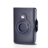 a blue leather camera case with a metal button