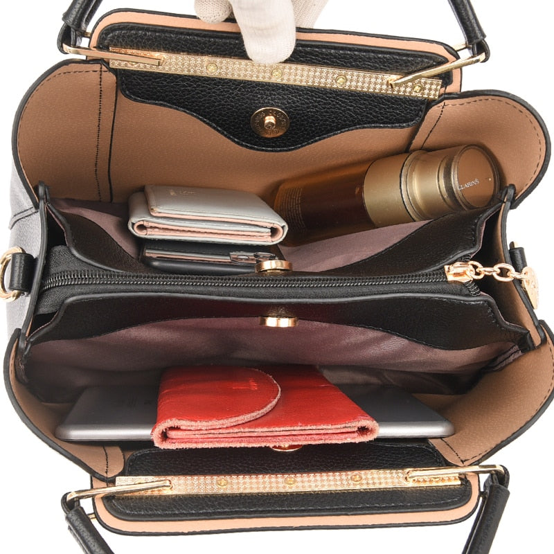 a woman's purse with a cell phone and wallet inside