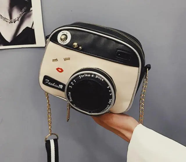 a person holding a camera in their hand