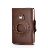 a brown leather camera case with a hole in the middle