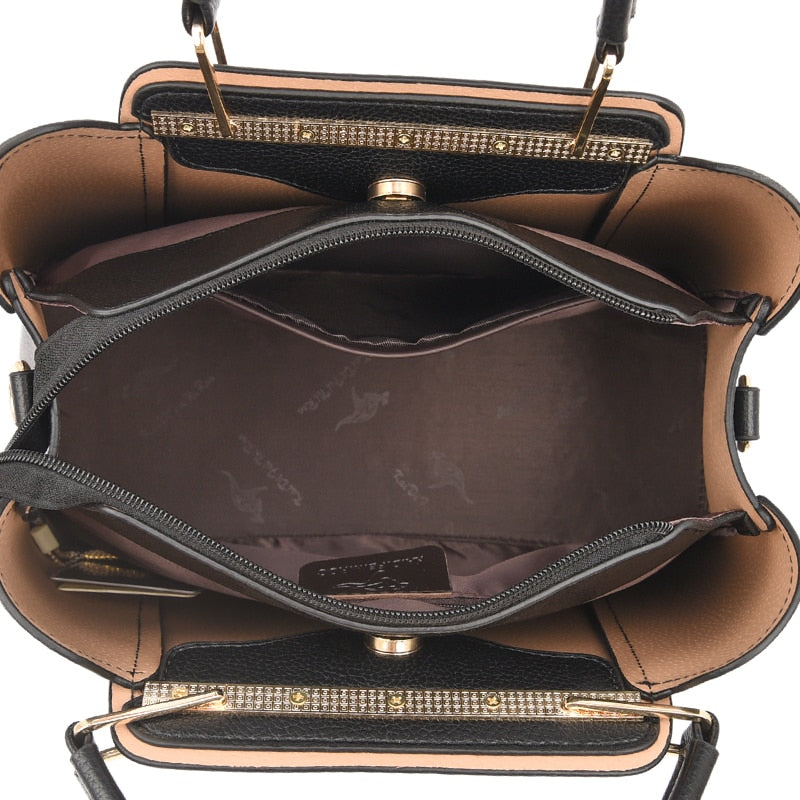 a black and tan purse on a white background