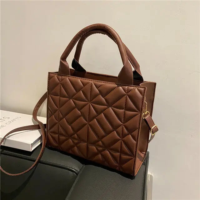 a brown purse sitting on top of a table
