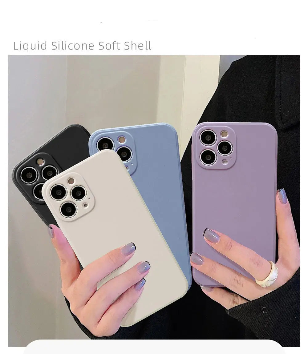 a woman holding two cell phones in her hands