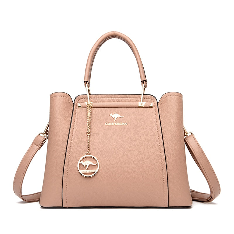 a pink handbag with a metal handle