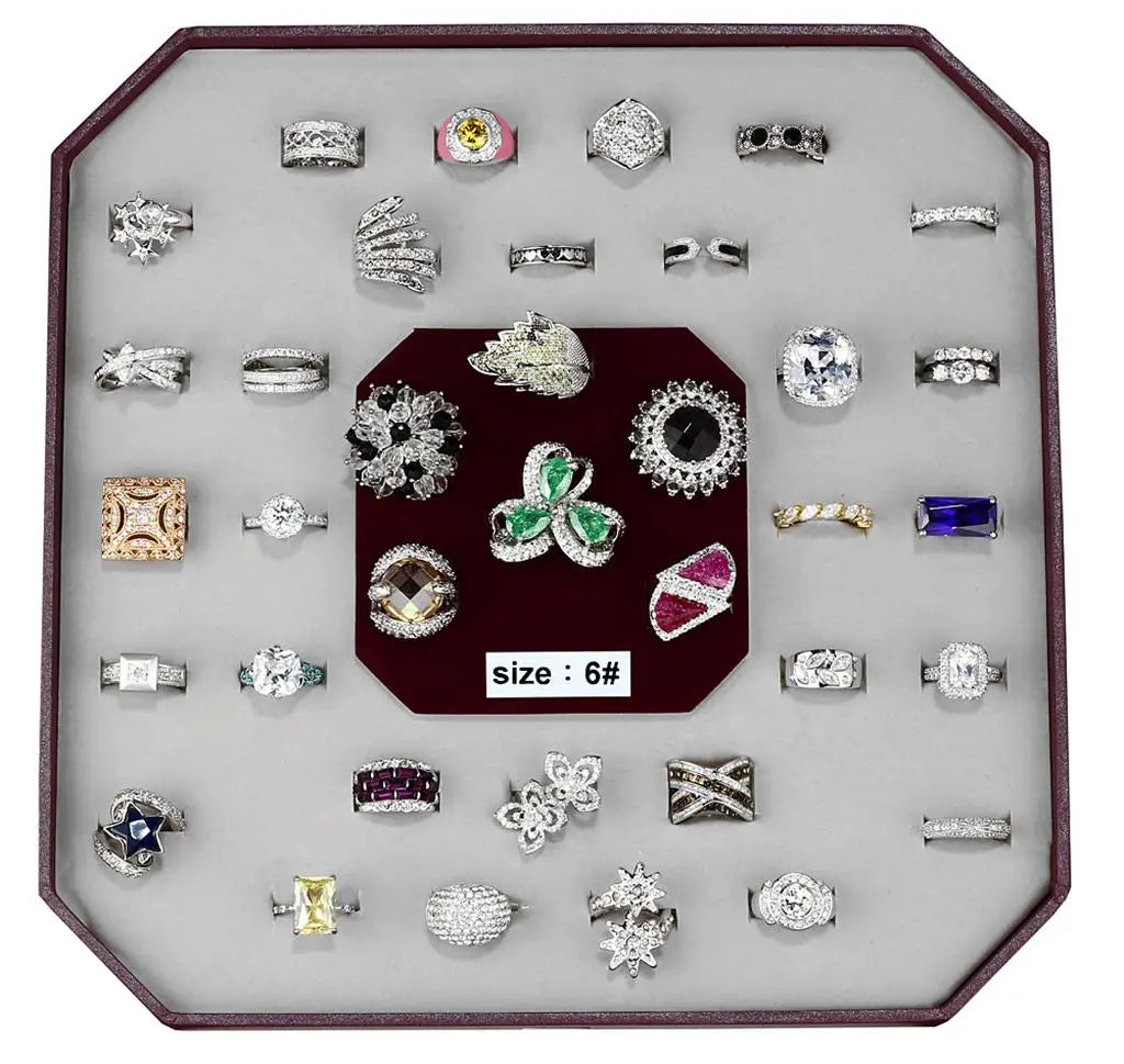 a display case holds a variety of rings