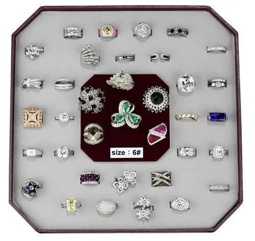 a display case holds a variety of rings
